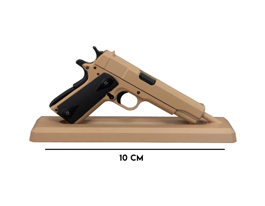 Crumb Catcher coyote miniature 1911 model on display stand
