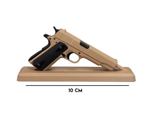 Crumb Catcher coyote miniature 1911 model on display stand