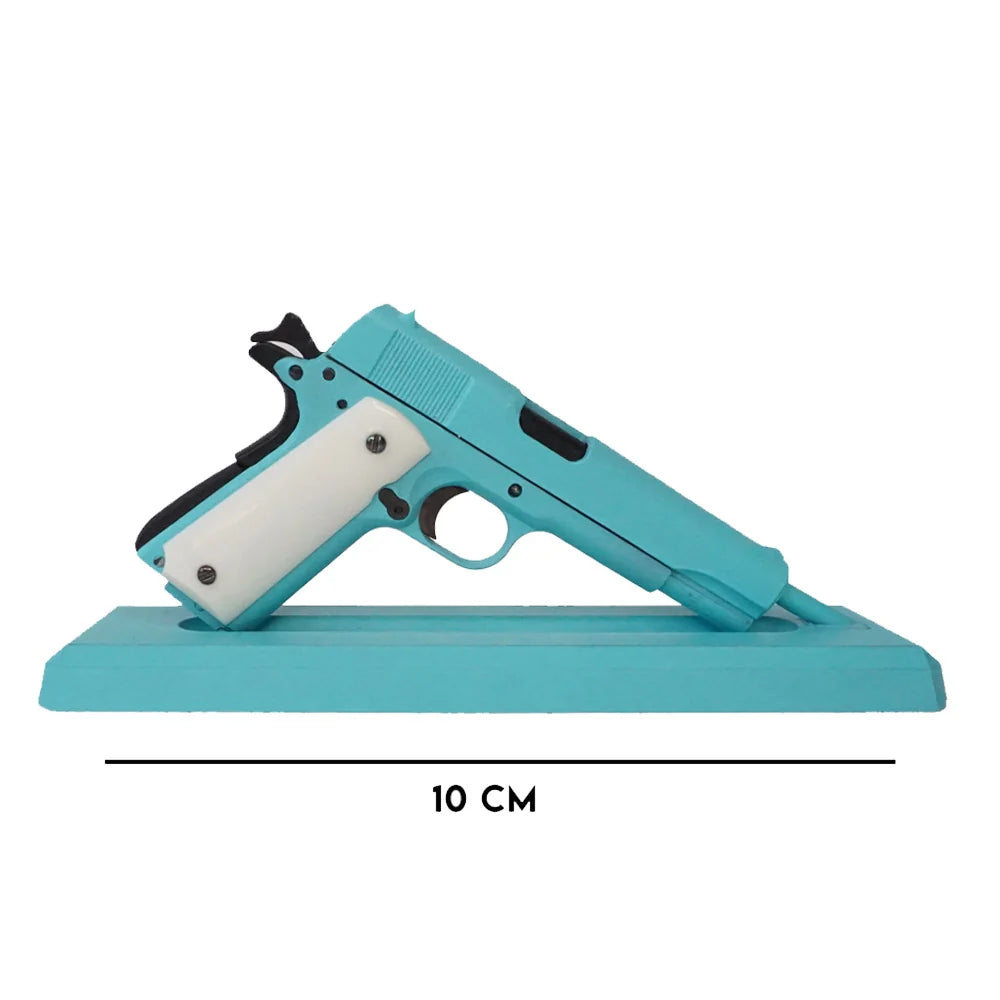 Bunny blue miniature 1911 model with pearl grips on display stand