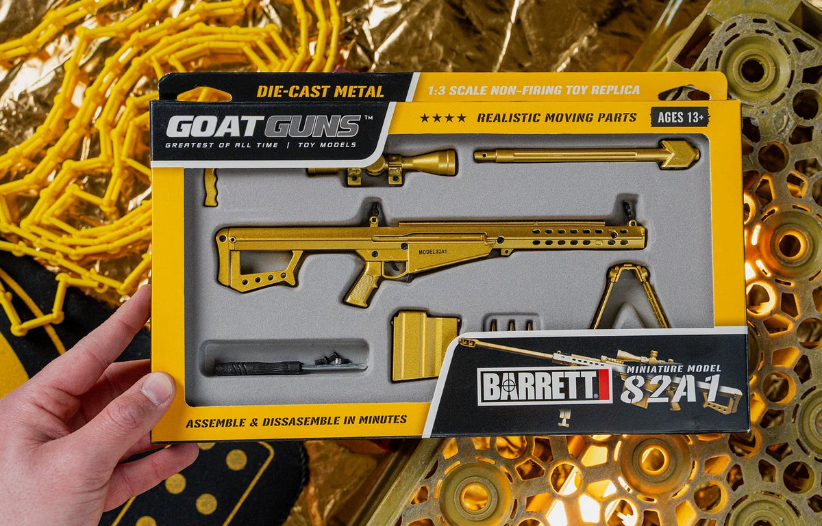 Gold 50 Cal model held in hand