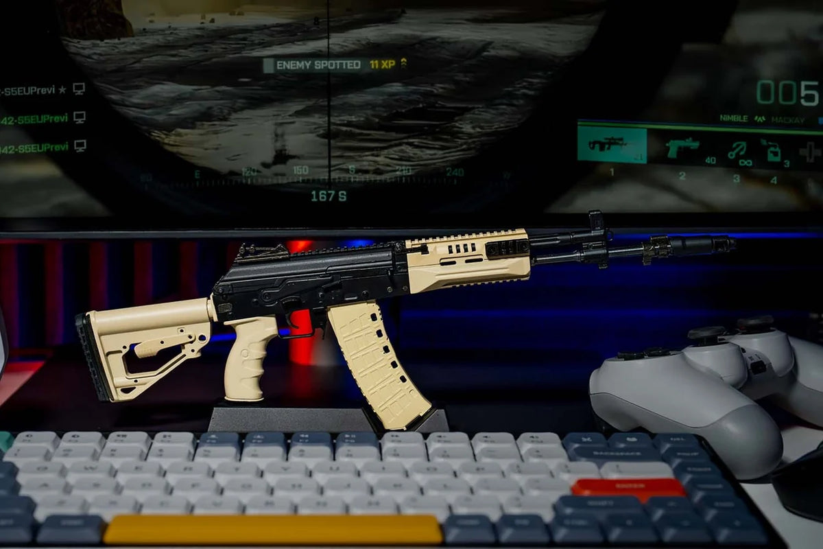 AK12 FDE miniature model displayed on a desk