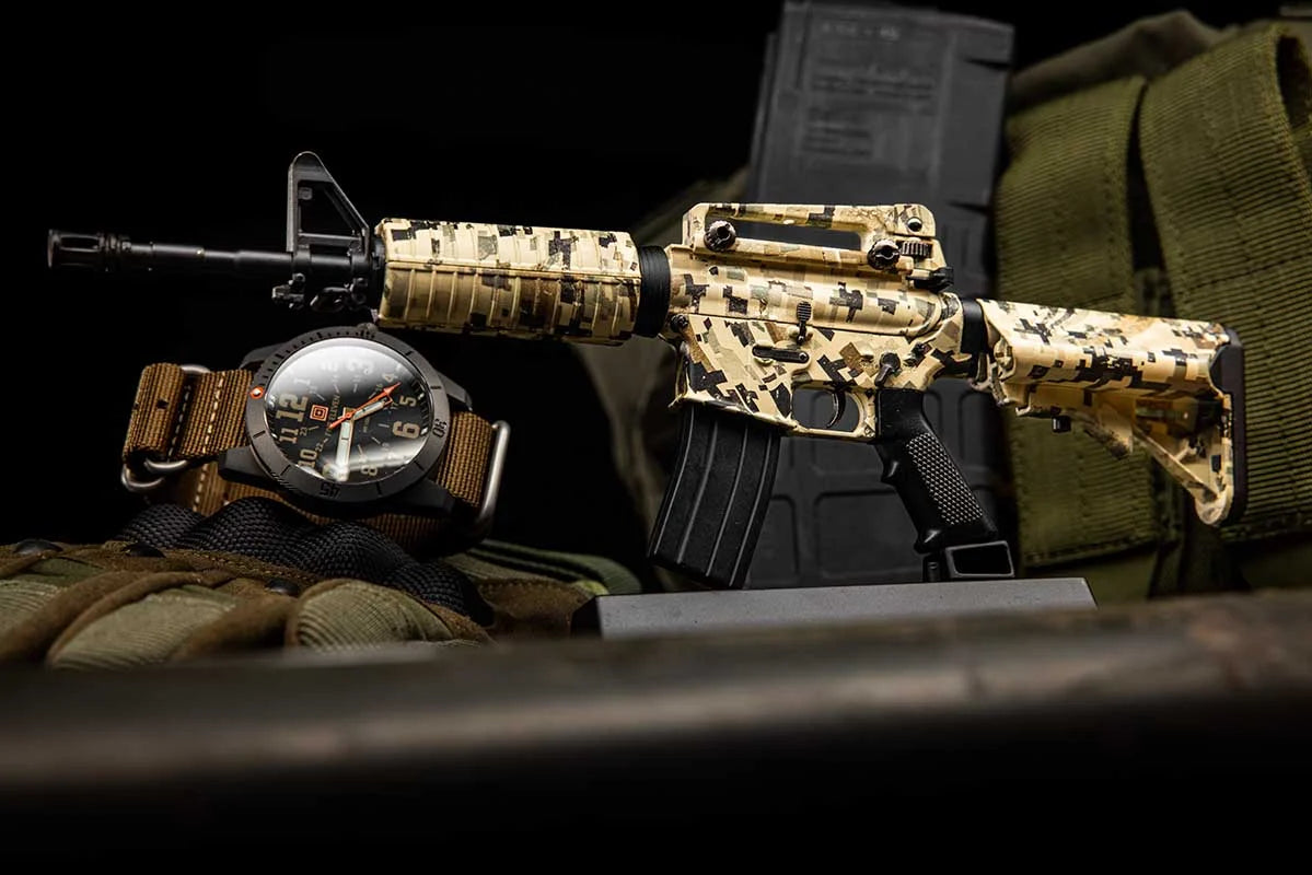 AR15 Desert Storm model beside a watch