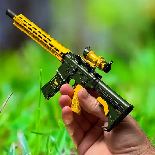 AR15 Deer Sarge miniature model held outdoors, green and yellow side view