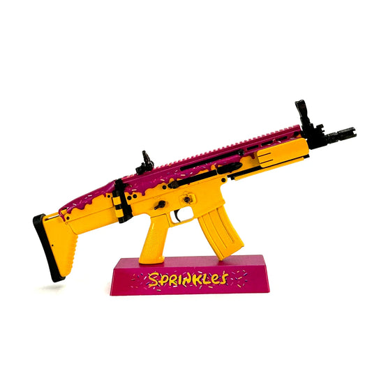 FN SCAR Sprinkles model on pink display stand
