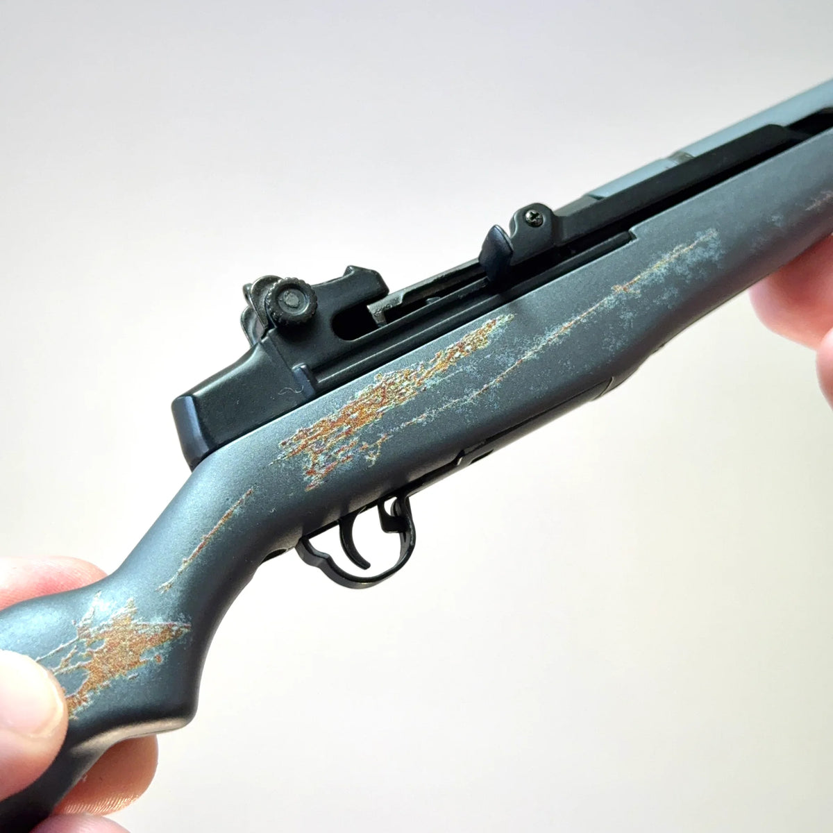 Medic M1 Garand model close-up of weathered grey finish and action