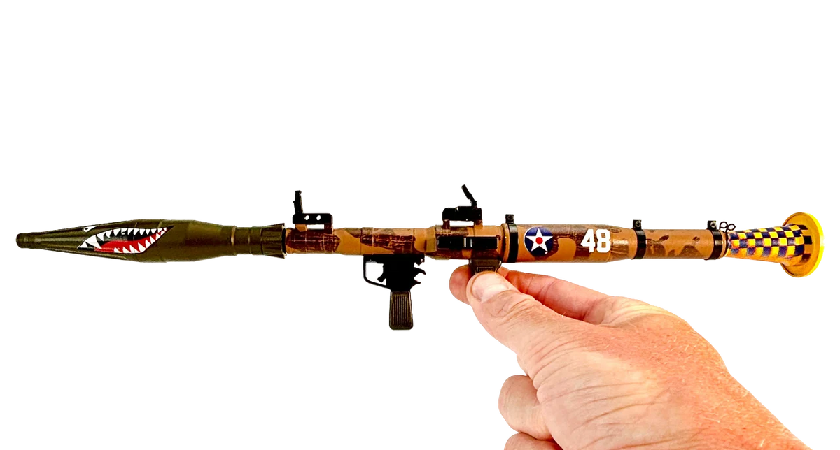 Nosebomb RPG miniature model held in hand