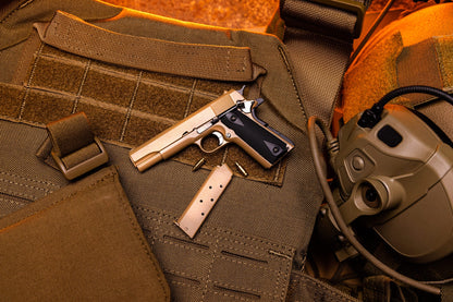 Crumb Catcher coyote miniature 1911 model on a tactical vest