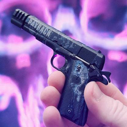 1911 Payback limited edition scale model held in hand