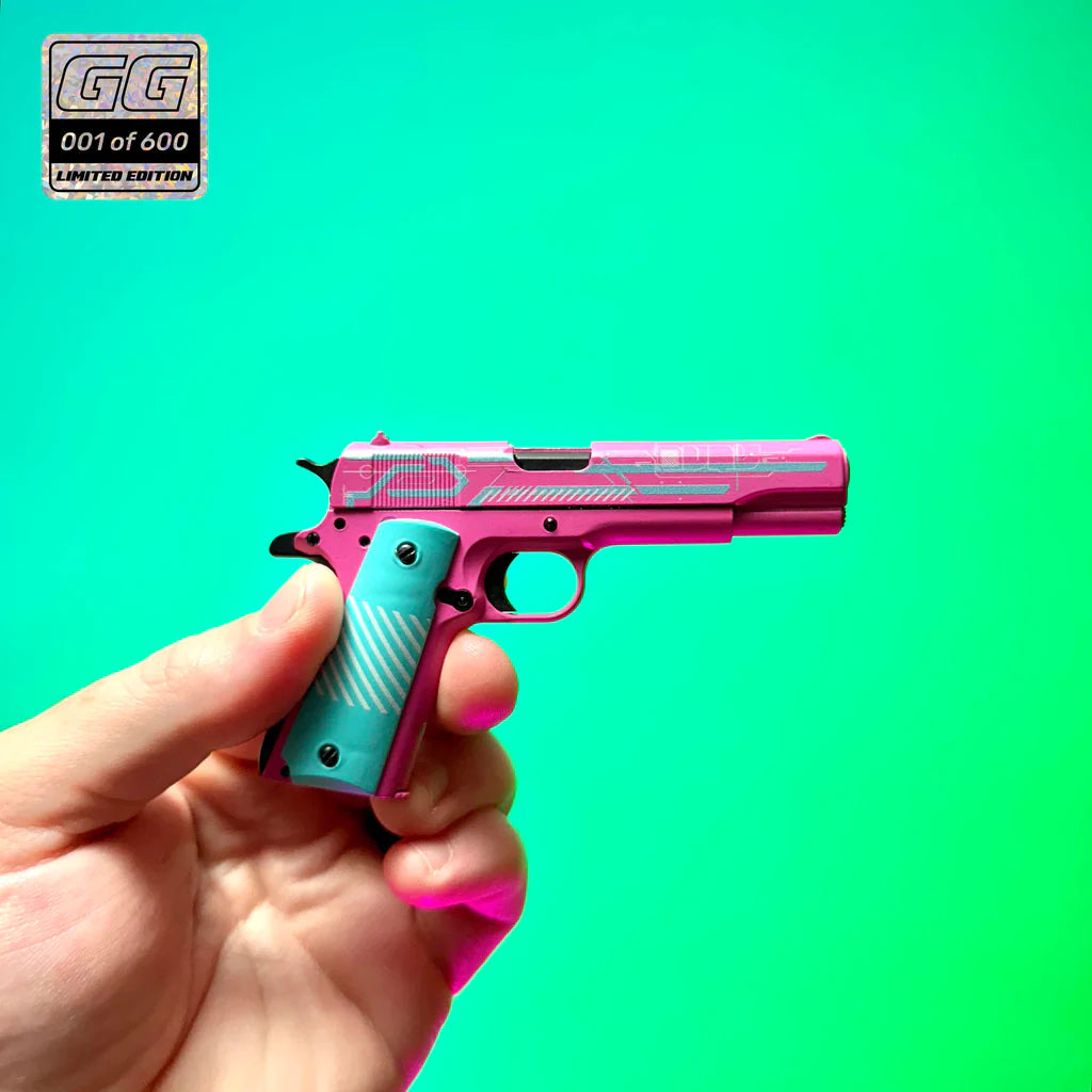 1911 Edge Runner limited edition miniature model held in hand against turquoise background
